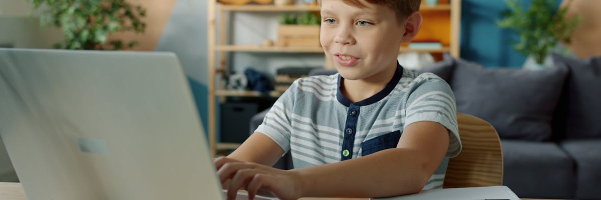 Child learning at a laptop